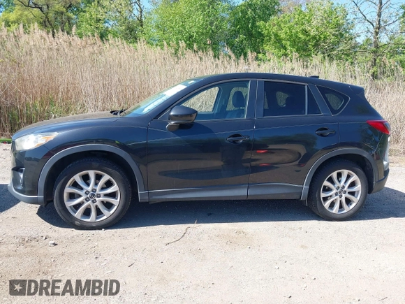 2013 Mazda CX-5 Grand Touring with VIN JM3KE4DE6D0127601, listed as a IAAI auction lot 42143558 with 95,719 mi miles and . Bid and sale history available at DreamBid. Image 14.