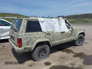 1996 Jeep Cherokee Sport with VIN 1J4FJ68S2TL154142, listed as a IAAI auction lot 42116515 with 197,095 mi miles and . Bid and sale history available at DreamBid. Image 4.