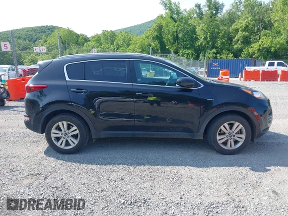2017 Kia Sportage LX z VIN KNDPMCAC1H7285906, wystawiony jako IAAI lot #42399031 z przebiegiem 142 909 mil mil oraz . Historia ofert i sprzedaży dostępna na DreamBid. Obrazek 13.