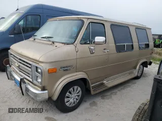 1989 Chevrolet Chevy Van z VIN 1GBEG25K2K7120100, wystawiony jako Copart lot #75508934 z przebiegiem Nie podano mil oraz Szkody całkowita. Historia ofert i sprzedaży dostępna na DreamBid. Obrazek 1.
