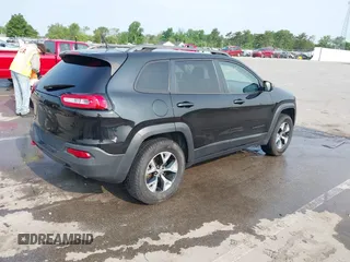 2015 Jeep Cherokee Trailhawk with VIN 1C4PJMBS6FW786622, listed as a IAAI auction lot 42403215 with 148,205 mi miles and . Bid and sale history available at DreamBid. Image 4.