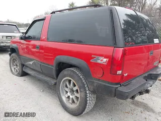 1996 Chevrolet Tahoe with VIN 3GNEK18R8TG153872, listed as a IAAI auction lot 41913476 with 120,686 mi miles. Bid and sale history available at carsss.com. Image 3.