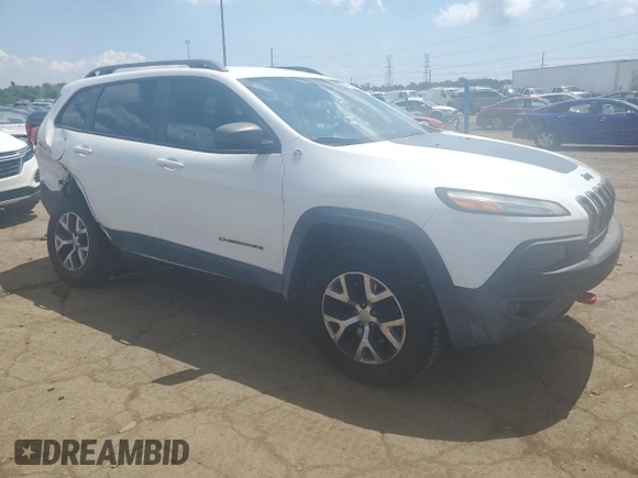 2015 Jeep Cherokee Trailhawk with VIN 1C4PJMBSXFW651000, listed as a Copart auction lot 64110515 with 135,571 mi miles and Clean title. Bid and sale history available at DreamBid. Image 4.