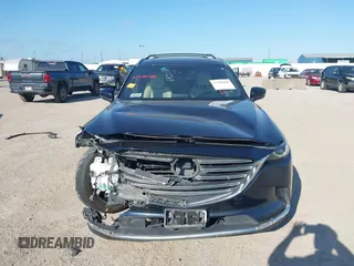 2016 Mazda CX-9 Grand Touring with VIN JM3TCADY6G0107064, listed as a IAAI auction lot 42580485 with 124,713 mi miles and . Bid and sale history available at DreamBid. Image 13.