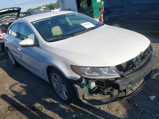2014 Volkswagen CC R-Line with VIN WVWBP7AN0EE504680, listed as a IAAI auction lot 41990269 with 137,660 mi miles. Bid and sale history available at carsss.com. Image 1.