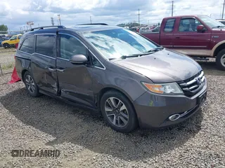 2014 Honda Odyssey Touring with VIN 5FNRL5H98EB038311, listed as a IAAI auction lot 42299555 with 161,698 mi miles and . Bid and sale history available at DreamBid. Image 1.