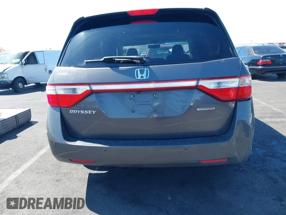 2013 Honda Odyssey Touring with VIN 5FNRL5H95DB045666, listed as a IAAI auction lot 42117219 with 50,715 mi miles and . Bid and sale history available at carsss.com. Image 16.
