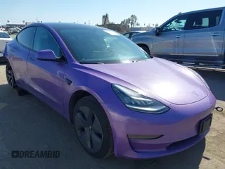 2020 Tesla Model 3 Standard Range Plus with VIN 5YJ3E1EA0LF739462, listed as a IAAI auction lot 42081889 with 65,254 mi miles. Bid and sale history available at carsss.com. Image 1.