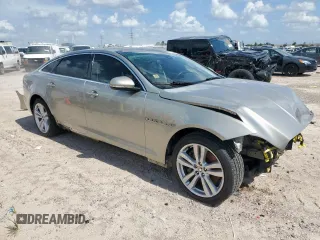 2013 Jaguar XJ Portfolio with VIN SAJWJ2GD5D8V49505, listed as a Copart auction lot 61171955 with 129,158 mi miles and Salvage title. Bid and sale history available at DreamBid. Image 4.