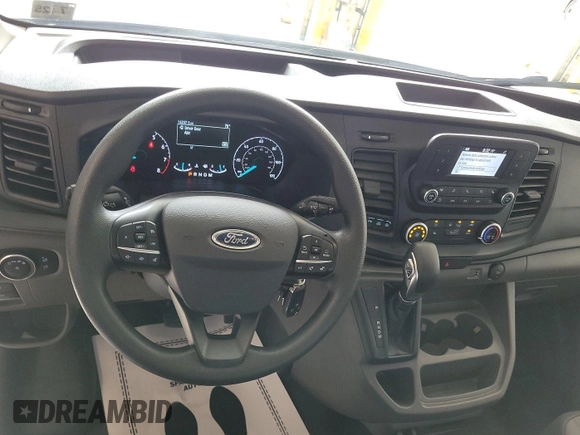 2023 Ford Transit Cargo with VIN 1FTBR1X86PKB99022, listed as a IAAI auction lot 42841650 with 14,234 mi miles and . Bid and sale history available at DreamBid. Image 9.