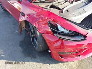 2021 Tesla Model 3 Performance with VIN 5YJ3E1EC9MF926301, listed as a IAAI auction lot 40959721 with 28,094 mi miles and . Bid and sale history available at DreamBid. Image 6.