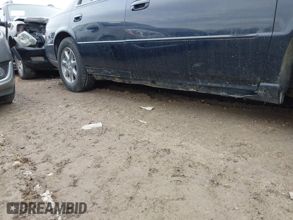 1999 Cadillac Seville Touring STS z VIN 1G6KY5493XU913994, wystawiony jako IAAI lot #41780695 z przebiegiem 60 375 mil mil oraz . Historia ofert i sprzedaży dostępna na DreamBid. Obrazek 13.