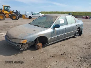 1996 Honda Accord EX w/Leather with VIN 1HGCD5666TA055580, listed as a IAAI auction lot 42021014 with 300,191 mi miles. Bid and sale history available at carsss.com. Image 2.