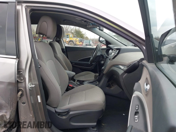 2016 Hyundai Santa Fe z VIN 5XYZTDLB1GG343763, wystawiony jako IAAI lot #41659641 z przebiegiem 96 415 mil mil oraz . Historia ofert i sprzedaży dostępna na DreamBid. Obrazek 5.