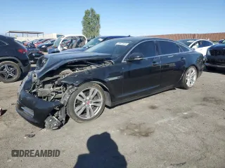 2014 Jaguar XJ with VIN SAJWA2GZXE8V59542, listed as a Copart auction lot 73672614 with 105,328 mi miles and Salvage Title. Bid and sale history available at carsss.com. Image 1.