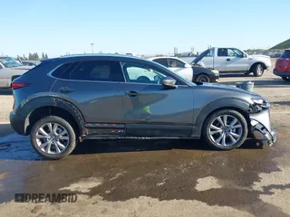2022 Mazda CX-30 S Premium with VIN 3MVDMBDL0NM413867, listed as a IAAI auction lot 42082560 with 12,375 mi miles and . Bid and sale history available at DreamBid. Image 13.