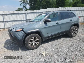 2014 Jeep Cherokee Trailhawk with VIN 1C4PJMBS1EW212024, listed as a Copart auction lot 58825265 with 99,087 mi miles and Salvage title. Bid and sale history available at DreamBid. Image 1.