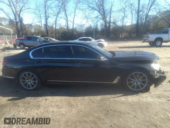 2018 BMW 7 Series 740i with VIN WBA7E2C57JG742257, listed as a IAAI auction lot 41353435 with 77,125 mi miles. Bid and sale history available at carsss.com. Image 14.