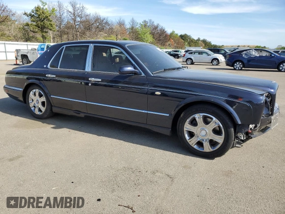 2005 Bentley Arnage R с VIN SCBLC37F15CX10517, выставлен на аукционе Copart как лот 54303364 с пробегом 116 865 миль миль и Списание • Salvage title. История ставок и продаж доступна на DreamBid. Изображение 4.