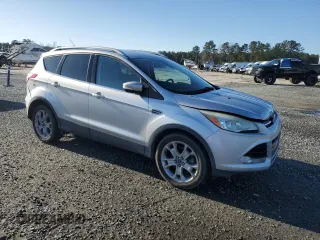 2015 Ford Escape Titanium with VIN 1FMCU0J91FUA94899, listed as a Copart auction lot 47746295 with 138,532 mi miles and Salvage Title. Bid and sale history available at DreamBid. Image 4.