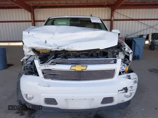 2014 Chevrolet Suburban LT with VIN 1GNSCJE04ER230536, listed as a IAAI auction lot 41666737 with 152,812 mi miles. Bid and sale history available at carsss.com. Image 12.