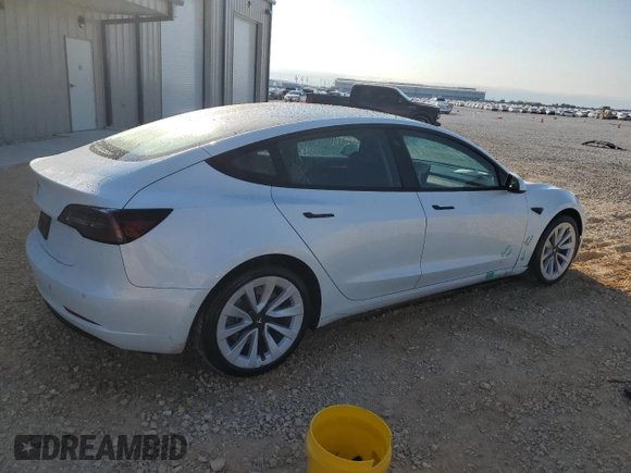 2022 Tesla Model 3 with VIN 5YJ3E1EA7NF184741, listed as a Copart auction lot 82487494 with 133,215 mi miles and Clean Title. Bid and sale history available at DreamBid. Image 3.