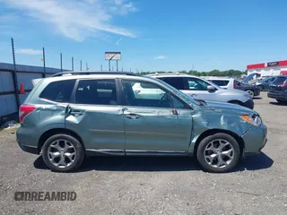 2016 Subaru Forester Touring with VIN JF2SJAVCXGH490507, listed as a IAAI auction lot 42070715 with 98,456 mi miles and . Bid and sale history available at DreamBid. Image 13.