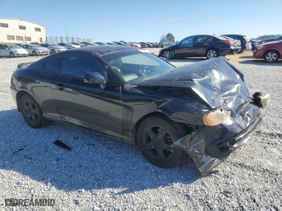2003 Hyundai Tiburon GT with VIN KMHHN65F33U072954, listed as a Copart auction lot 77698094 with 235,445 mi miles and Salvage Title. Bid and sale history available at carsss.com. Image 4.