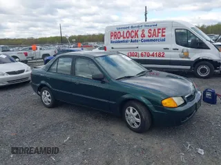 1999 Mazda Protege DX z VIN JM1BJ2226X0152861, wystawiony jako IAAI lot #42008276 z przebiegiem 63 152 mil mil oraz . Historia ofert i sprzedaży dostępna na DreamBid. Obrazek 1.