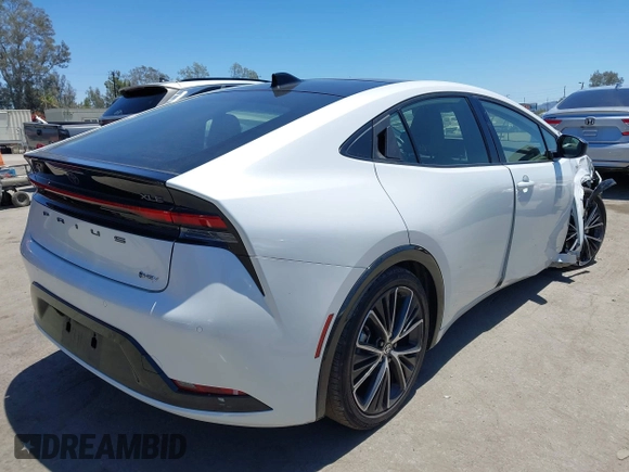 2024 Toyota Prius LE with VIN JTDACAAU2R3020703, listed as a IAAI auction lot 42644240 with 32,715 mi miles and . Bid and sale history available at DreamBid. Image 4.