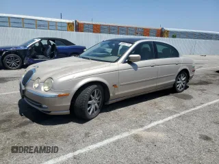 2000 Jaguar S-Type V6 z VIN SAJDA01CXYFL45229, wystawiony jako Copart lot #59052715 z przebiegiem 151 906 mil mil oraz Czysty tytuł • Clean title. Historia ofert i sprzedaży dostępna na DreamBid. Obrazek 1.