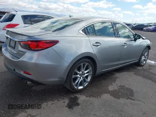 2014 Mazda 6 i Grand Touring with VIN JM1GJ1W57E1104801, listed as a IAAI auction lot 42060144 with 95,212 mi miles. Bid and sale history available at carsss.com. Image 4.