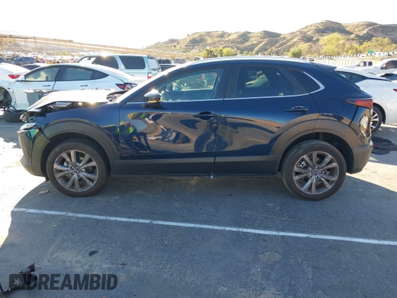 2023 Mazda CX-30 S Select with VIN 3MVDMBBM8PM514475, listed as a IAAI auction lot 41664456 with 33,076 mi miles and . Bid and sale history available at DreamBid. Image 14.