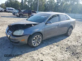 2006 Volkswagen Jetta z VIN 3VWDG71K26M673879, wystawiony jako Copart lot #75674634 z przebiegiem 93 689 mil mil oraz Szkoda całkowita • Salvage title. Historia ofert i sprzedaży dostępna na DreamBid. Obrazek 1.