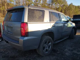 2019 Chevrolet Tahoe LT with VIN 1GNSCBKC8KR123828, listed as a IAAI auction lot 41256573 with 125,618 mi miles. Bid and sale history available at carsss.com. Image 4.