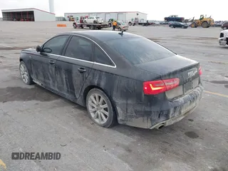 2013 Audi A6 3.0T Prestige with VIN WAUHGAFC3DN061788, listed as a IAAI auction lot 41129245 with 137,575 mi miles. Bid and sale history available at carsss.com. Image 3.