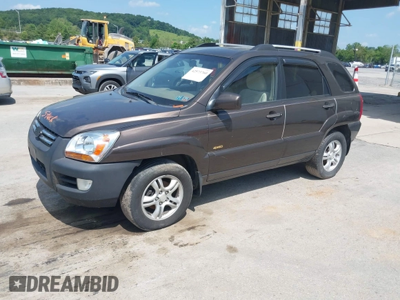 2005 Kia Sportage LX with VIN KNDJE723957075445, listed as a IAAI auction lot 42573760 with 185,000 mi miles and . Bid and sale history available at DreamBid. Image 2.