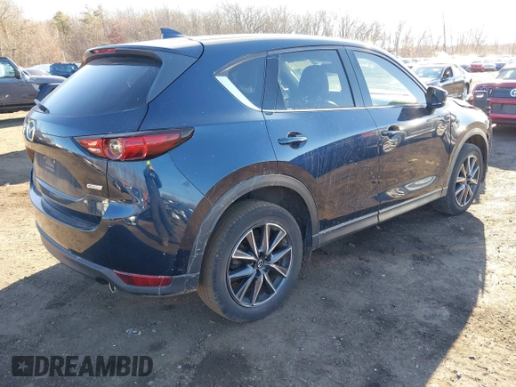 2017 Mazda CX-5 Grand Touring with VIN JM3KFBDL0H0104806, listed as a IAAI auction lot 41621964 with 60,728 mi miles. Bid and sale history available at carsss.com. Image 4.