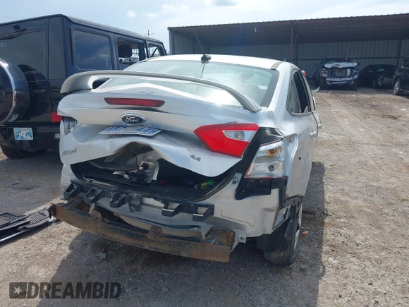 2015 Ford Focus Titanium with VIN 1FADP3J27FL347983, listed as a IAAI auction lot 42634821 with 156,216 mi miles and . Bid and sale history available at DreamBid. Image 4.