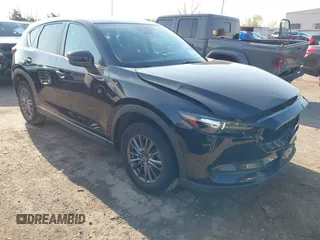 2019 Mazda CX-5 Touring with VIN JM3KFACM6K0533203, listed as a IAAI auction lot 41973125 with 106,882 mi miles and . Bid and sale history available at carsss.com. Image 1.