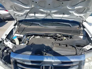 2012 Honda Pilot Touring with VIN 5FNYF3H91CB020673, listed as a IAAI auction lot 41721836 with 123,607 mi miles and . Bid and sale history available at carsss.com. Image 10.