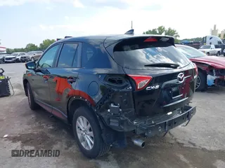2016 Mazda CX-5 Touring with VIN JM3KE2CY5G0653108, listed as a IAAI auction lot 37717249 with 90,704 mi miles and . Bid and sale history available at DreamBid. Image 3.