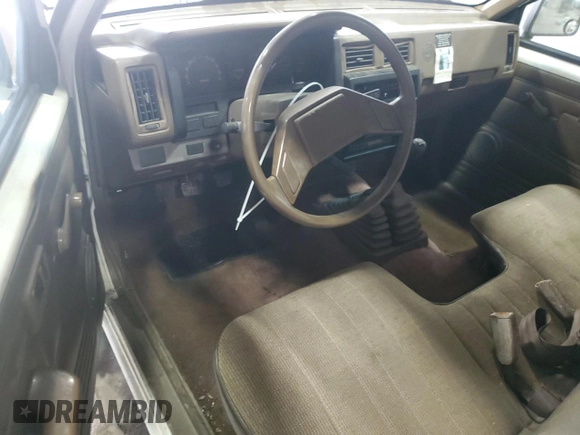 1988 Nissan Hardbody E z VIN 1N6ND16Y3JC351348, wystawiony jako Copart lot #80864914 z przebiegiem 184 397 mil mil oraz Szkody całkowita. Historia ofert i sprzedaży dostępna na DreamBid. Obrazek 8.