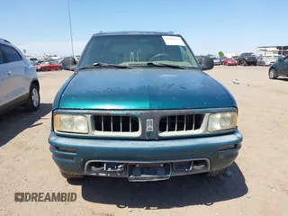 1996 Oldsmobile Bravada z VIN 1GHDT13W5T2711291, wystawiony jako IAAI lot #42502672 z przebiegiem 219 062 mil mil oraz . Historia ofert i sprzedaży dostępna na DreamBid. Obrazek 6.