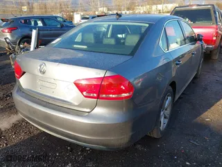 2013 Volkswagen Passat SE with VIN 1VWBP7A33DC025563, listed as a IAAI auction lot 41811324 with 238,800 mi miles. Bid and sale history available at carsss.com. Image 4.
