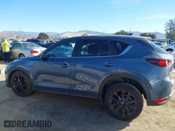 2021 Mazda CX-5 Touring with VIN JM3KFBCM9M0434433, listed as a IAAI auction lot 41425112 with 57,527 mi miles. Bid and sale history available at carsss.com. Image 15.