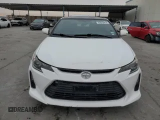 2014 Scion tC z VIN JTKJF5C7XE3079538, wystawiony jako Copart lot #85018414 z przebiegiem 136 905 mil mil oraz Czysty tytuł • Clean title. Historia ofert i sprzedaży dostępna na DreamBid. Obrazek 5.