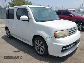 2010 Nissan Cube S z VIN JN8AZ2KR3AT153090, wystawiony jako IAAI lot #42565842 z przebiegiem 187 741 mil mil oraz . Historia ofert i sprzedaży dostępna na DreamBid. Obrazek 1.
