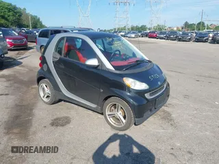 2009 Smart fortwo Pure with VIN WMEEJ31X29K214183, listed as a IAAI auction lot 42606297 with 113,991 mi miles and . Bid and sale history available at DreamBid. Image 1.