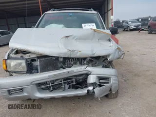 1999 Isuzu Rodeo S with VIN 4S2CK58W4X4358898, listed as a IAAI auction lot 41360738 with 184,948 mi miles and . Bid and sale history available at carsss.com. Image 6.